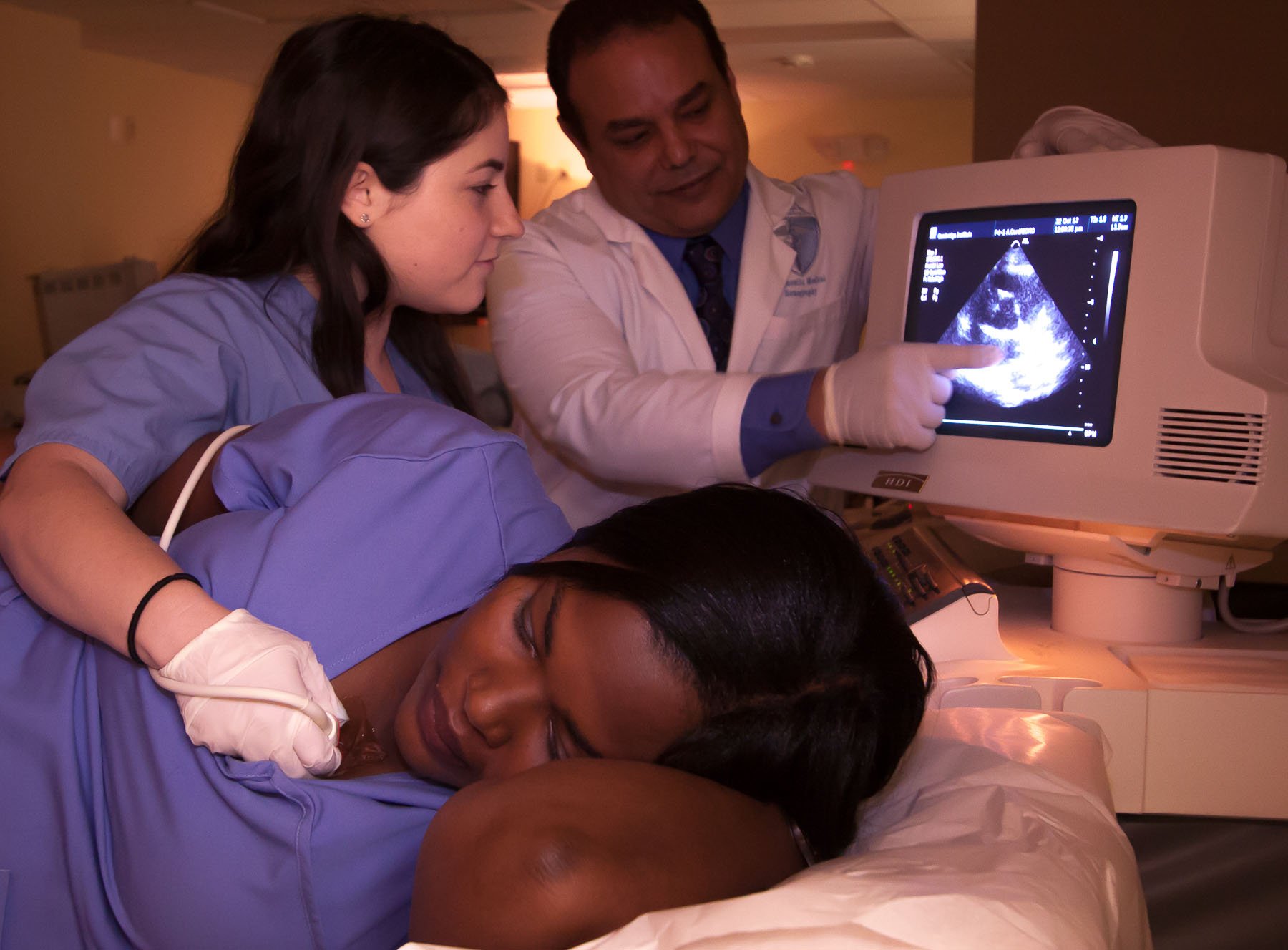 healthcare professor showing student sonogram imaging