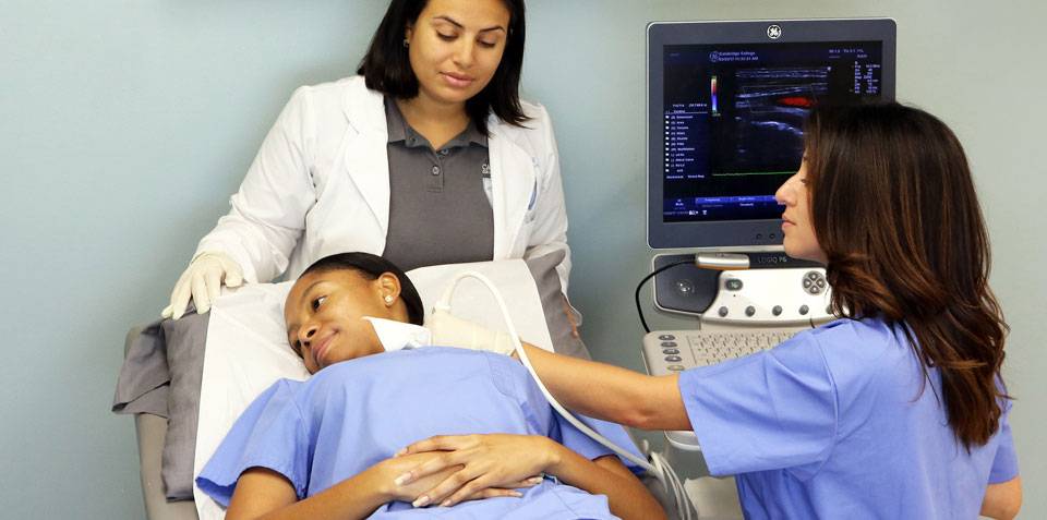 Diagnostic medical sonographer is performing tests on a patient