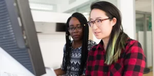 Two femle information technology professionals