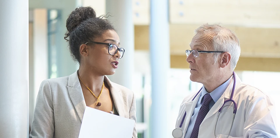 two healthcare administrative professionals