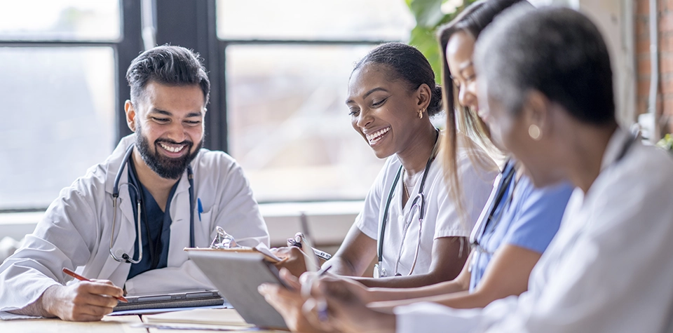 A group of professional; health administrators are in a meeting